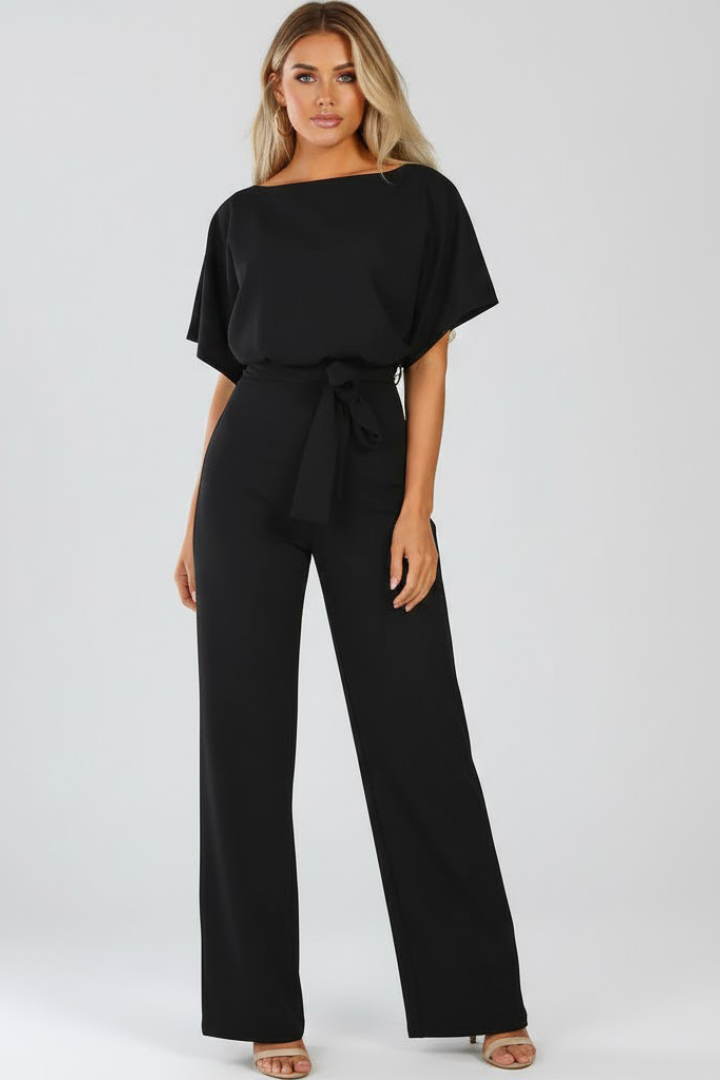 Olive green women's belted wide leg jumpsuit. Short sleeves, elegant & comfortable for effortless summer fashion.