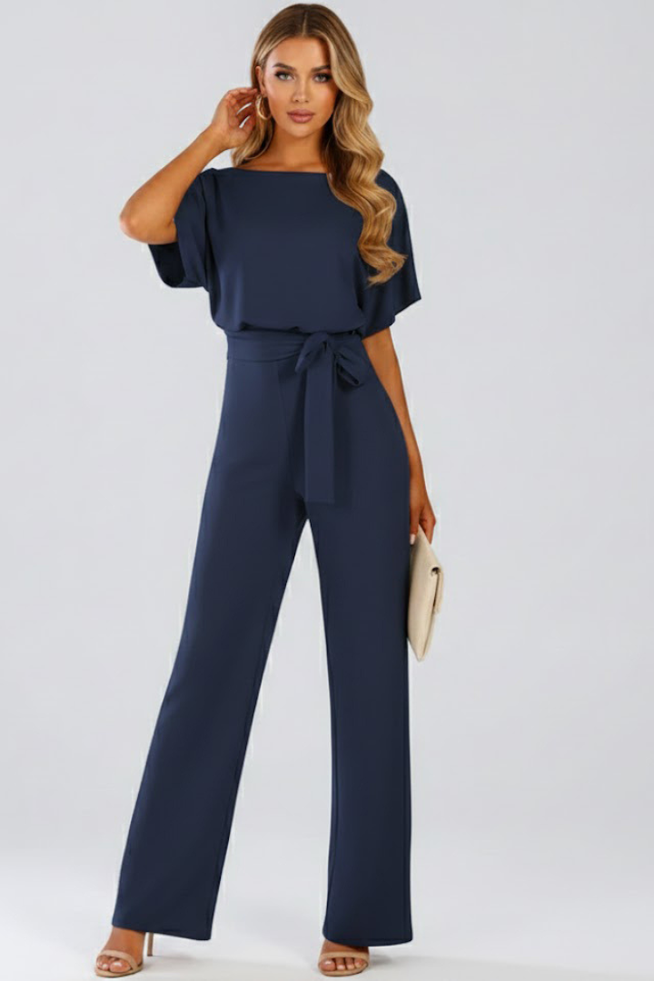 Elegant women's wide leg short sleeve jumpsuit with a stylish belt. Perfect one-piece for summer's day to night events.