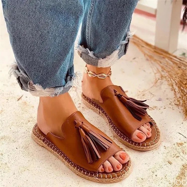 Women's cushioned woven sandals designed for all-day comfort. Ideal casual summer slides & beach footwear.