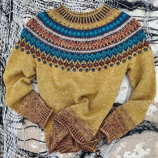 Yellow women's Fair Isle crew neck sweater. Features intricate Nordic pattern, cozy fabric & relaxed winter style.