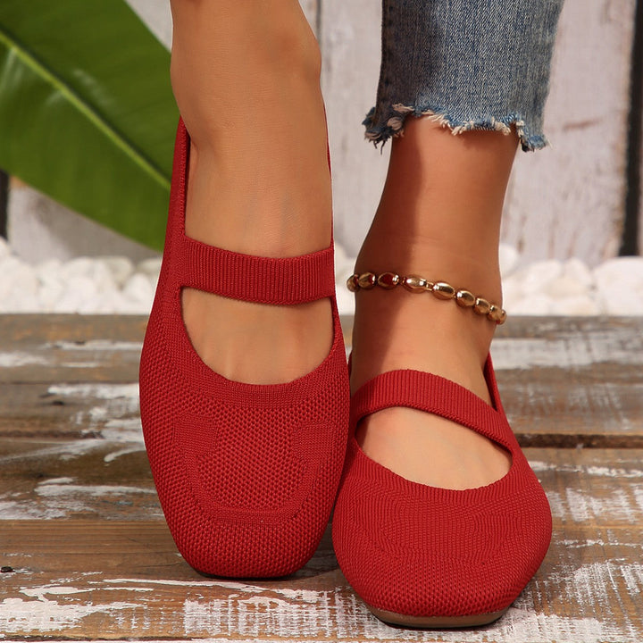 Slip-on women's yellow ballet flats with a cheerful smiling face design and comfortable fit, great for casual footwear.