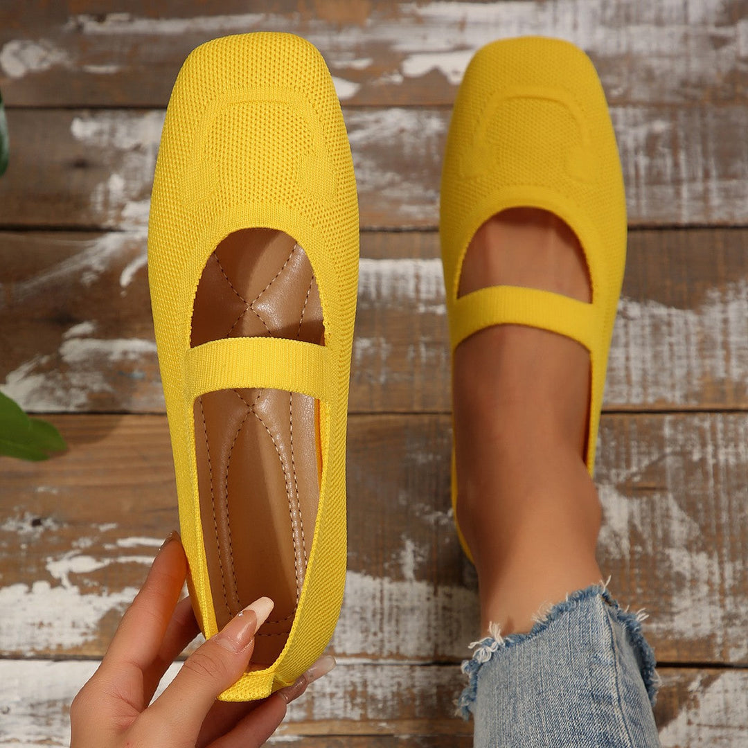 Fun yellow women's Mary Jane flats with a smiling face design. Comfortable, casual slip-ons for everyday wear.