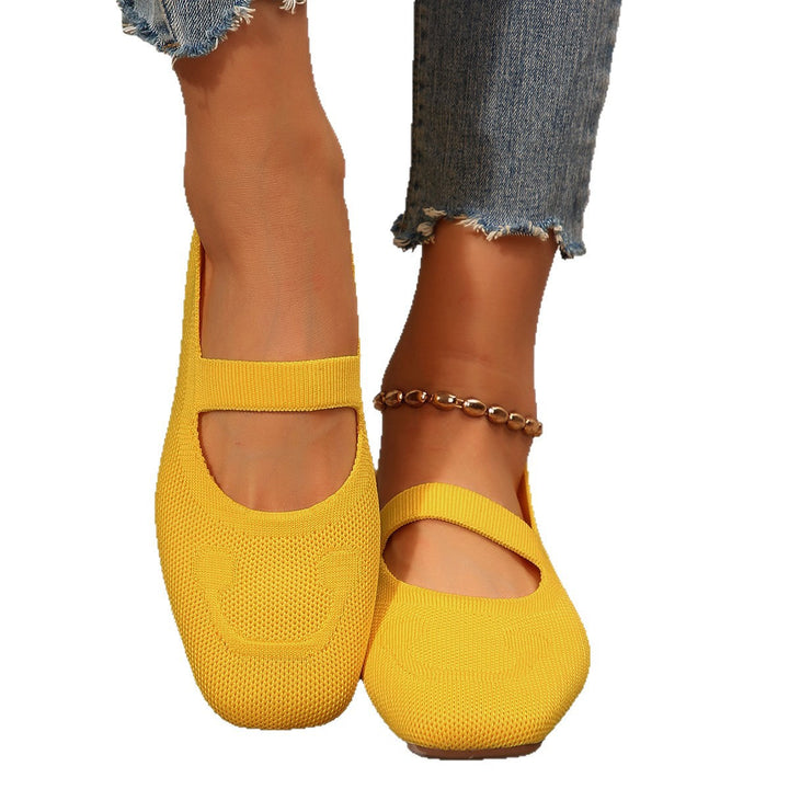 Red women's ballet flats, Mary Jane style, featuring a charming smiling face and practical adjustable strap.