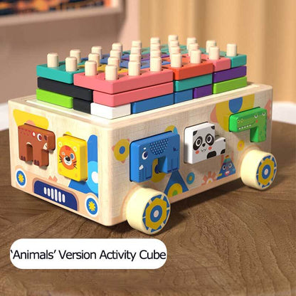 Detail of wooden activity cube's gear mechanisms, promoting cause and effect understanding in kids.