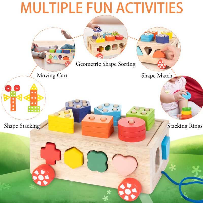 Close-up of a wooden activity cube's shape sorter side, teaching shapes to young children.