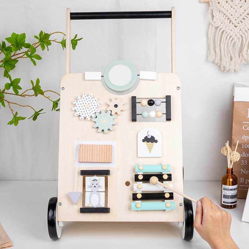 Baby activity center in wood with interactive learning features for infants