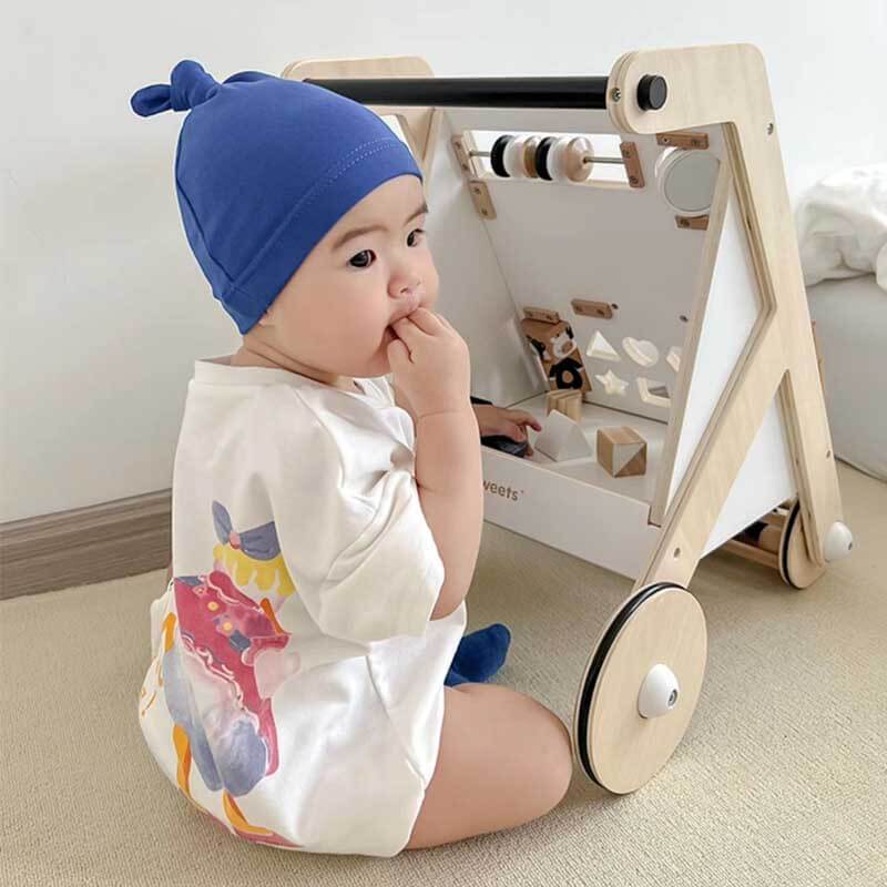 Wooden baby walker with bead maze and shape sorter, promoting early development