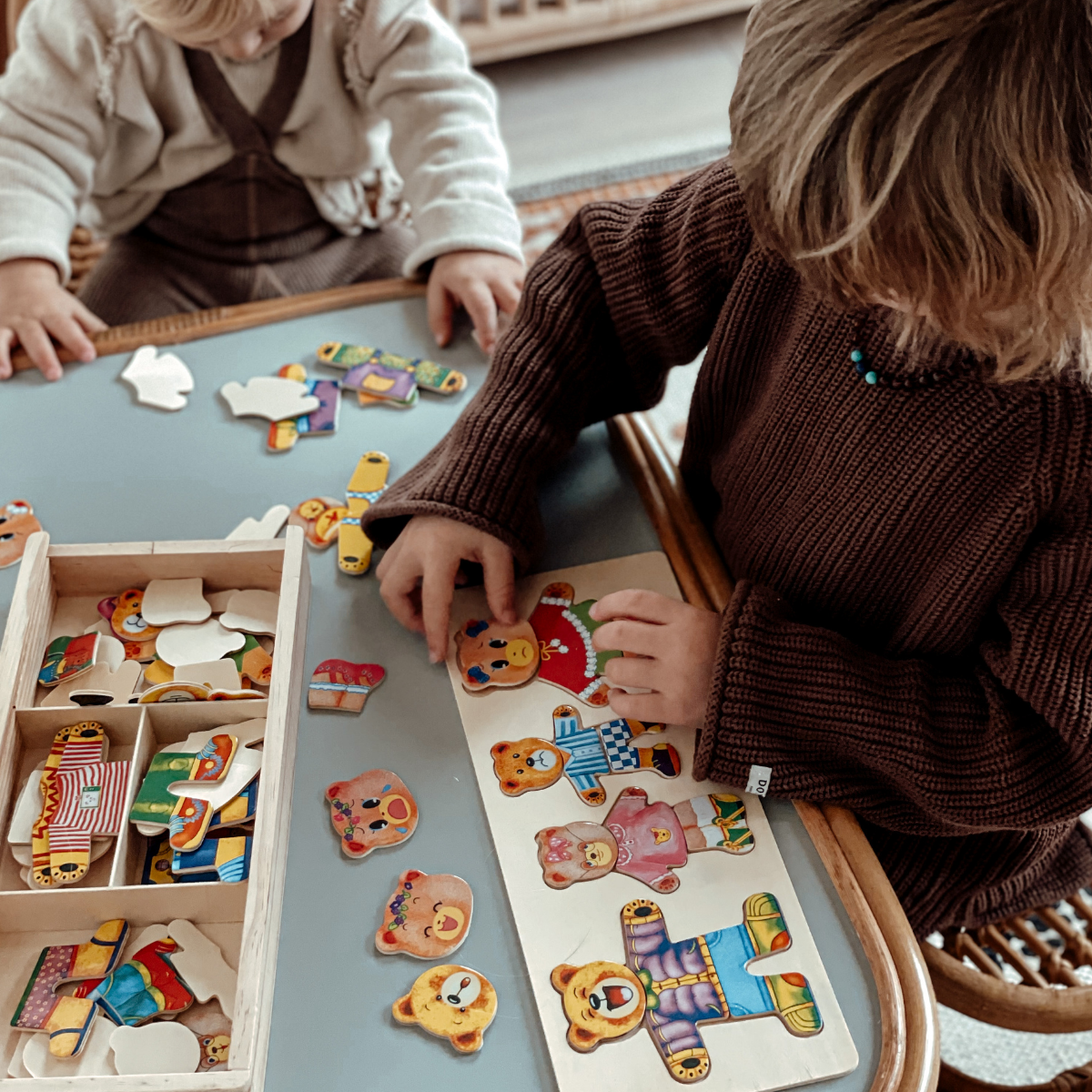 Sustainable wooden jigsaw puzzle for kids, fostering dress-up play.
