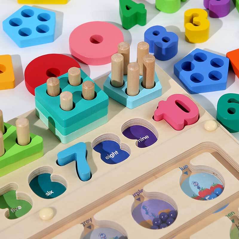Close-up of child's hands sorting colored rings on a wooden peg, early learning toy