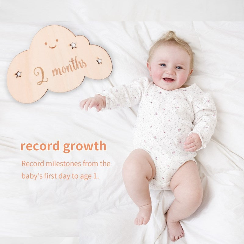 Collection of 12 wooden baby milestone cards, a beautiful keepsake for capturing first year growth.