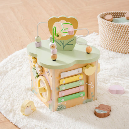 Preschool wooden activity cube, a Montesssori toy for toddlers to learn and play.