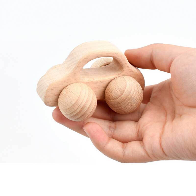 Close-up of a wooden musical hand bell set, ideal educational toy for babies and toddlers.