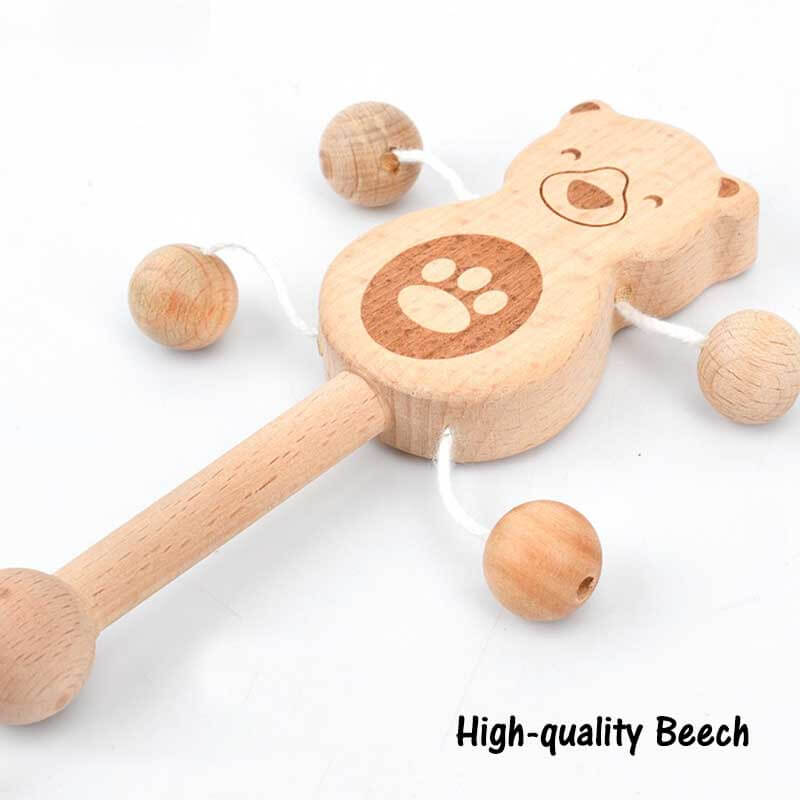 Assorted wooden musical hand bells, a charming and educational baby toy made from beech wood.