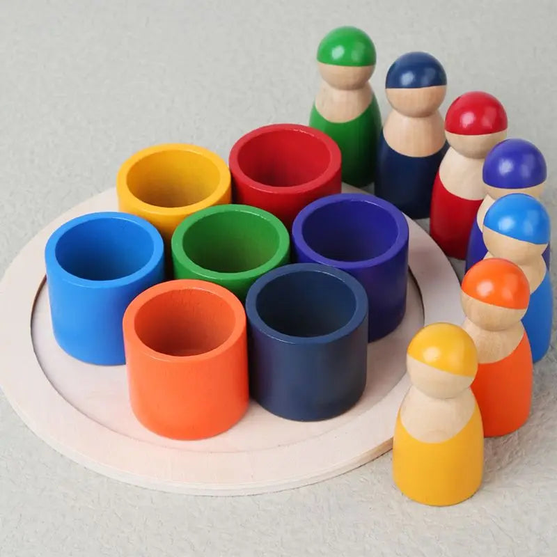 Colorful wooden stacking toy, rainbow design, ideal for young children's fine motor skill development.