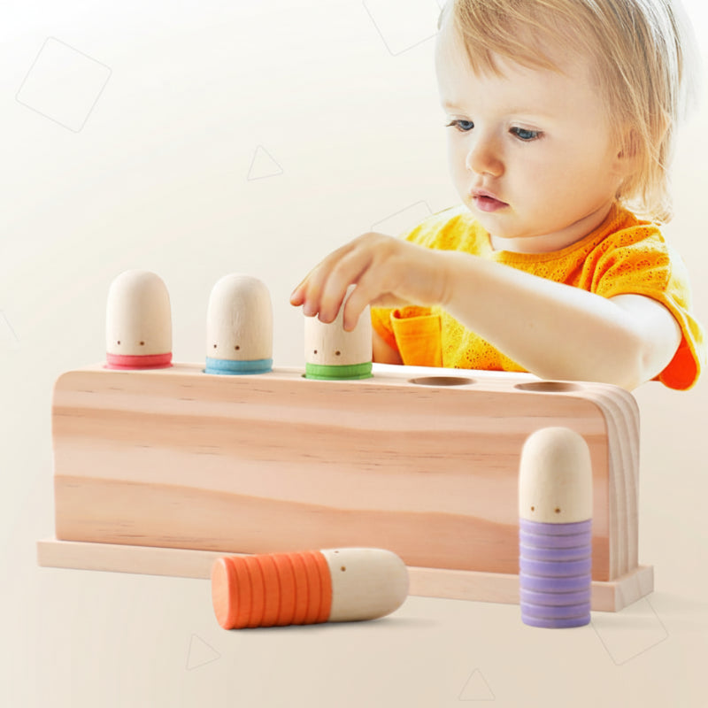 Wooden sensory toy for toddlers, colorful rings, enhances motor skills & baby development.