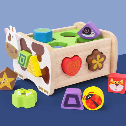 Preschooler happily engaging with shape sorting car, a durable wooden educational toy for kids' development