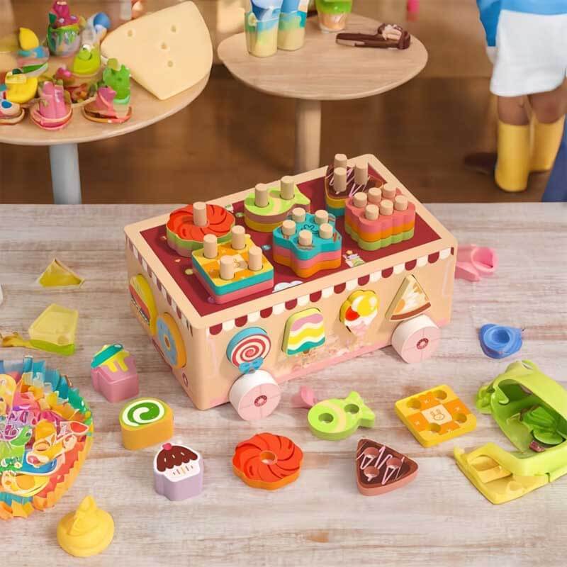 Close-up of a wooden shape sorting toy car's colorful animal and ice cream shaped blocks.
