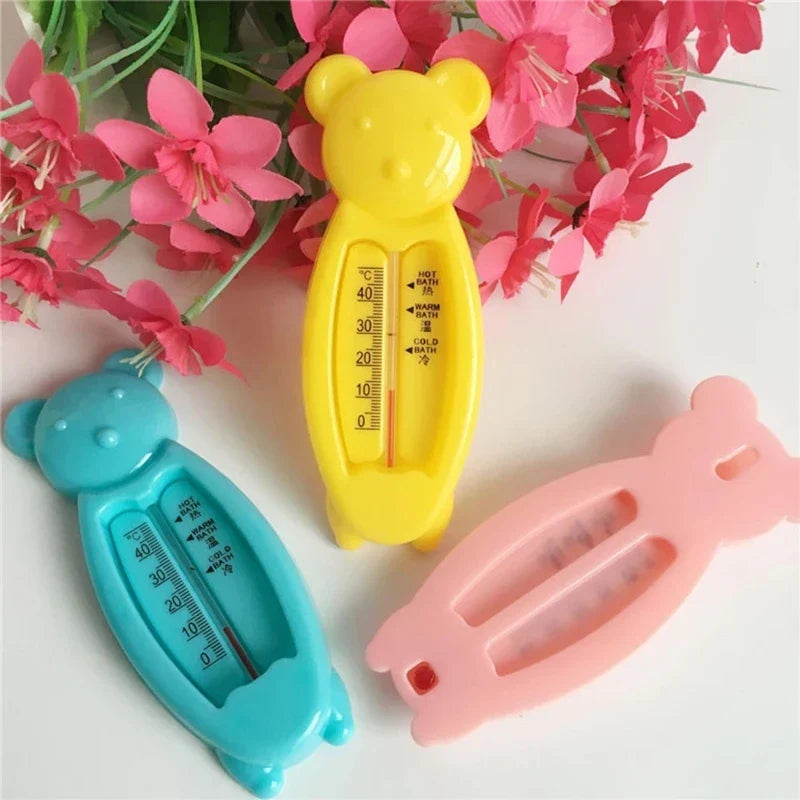 Baby safety bath thermometer shaped like a yellow bear, perfect for monitoring water temperature.