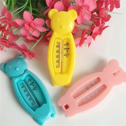 Baby safety bath thermometer shaped like a yellow bear, perfect for monitoring water temperature.