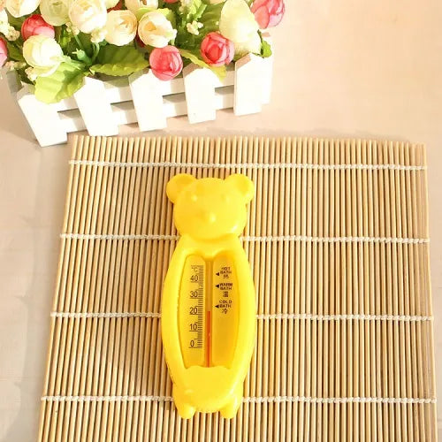Close-up of a yellow floating bear bath thermometer, showing easy-to-read water sensor.