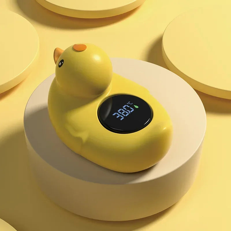 Set of baby bath essentials including a yellow duck thermometer, ideal for new parents, safety sensor