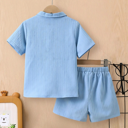 Two-piece boys' blue wave summer set, short sleeve tee and shorts, ideal for casual kids fashion.