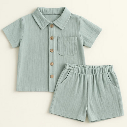 Young boy models a blue summer outfit set, perfect for casual wear and breathability.