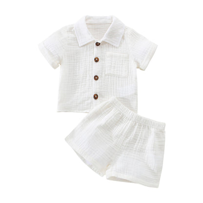 Two-piece summer outfit set for toddler boys, featuring light blue top and matching shorts.