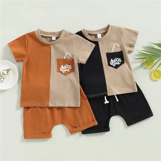 Young boy wearing a blue cotton summer top and matching shorts set, ideal for comfortable play.
