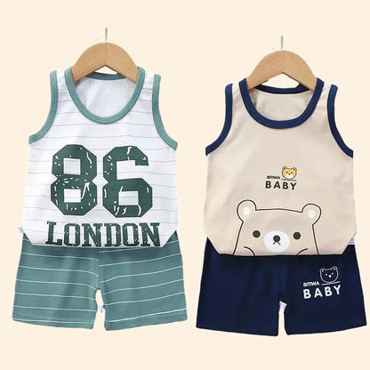 Young child models a blue cotton blend activewear set; perfect for summer play and sports.