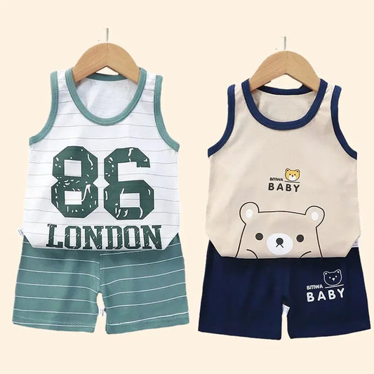 Young child models a blue cotton blend activewear set; perfect for summer play and sports.