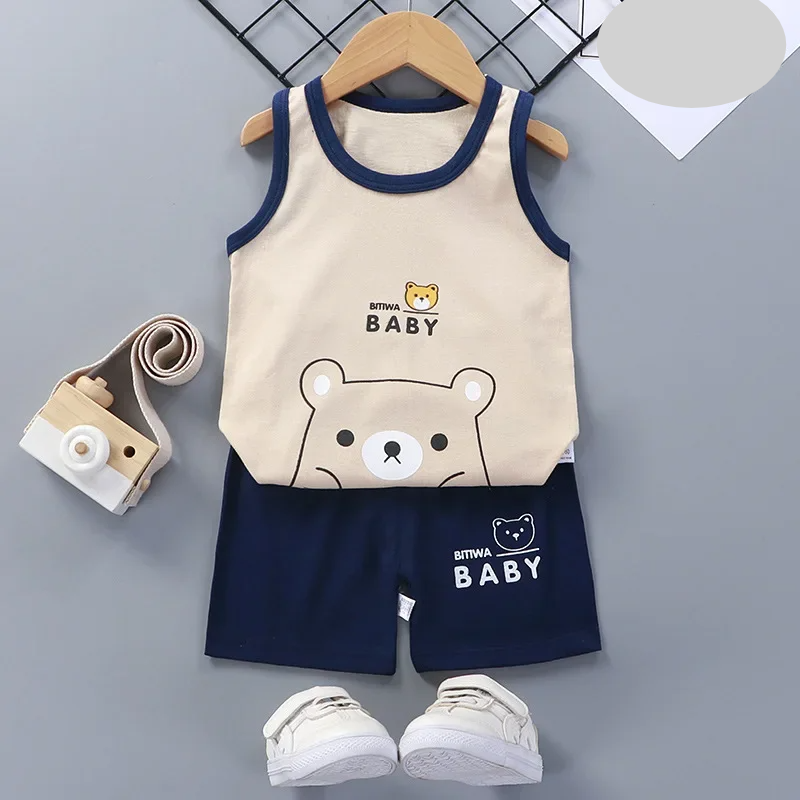 Full shot of a happy child wearing the blue summer sports set, ready for outdoor fun.