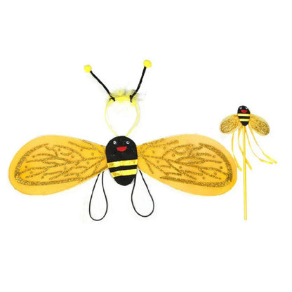 Girl smiling in her complete bee costume, including a comfortable black and yellow striped leotard, tutu, and large wings.