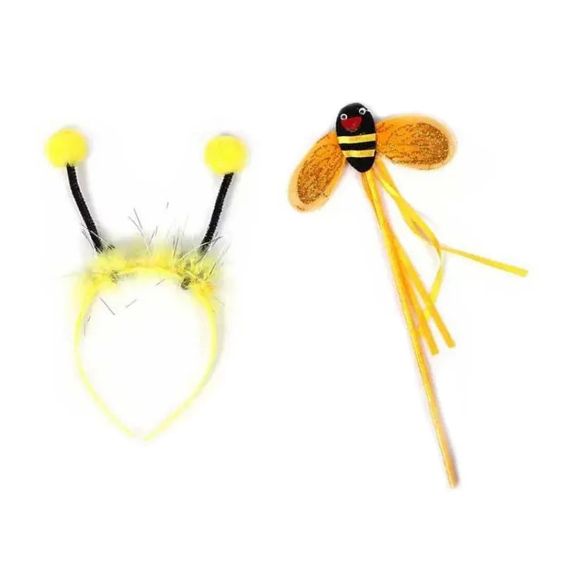 A happy girl playing dress-up in her complete bee costume set, showcasing the striped tutu, wings, and cute antennae.