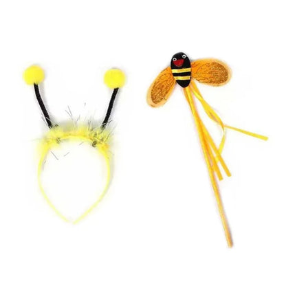 A happy girl playing dress-up in her complete bee costume set, showcasing the striped tutu, wings, and cute antennae.